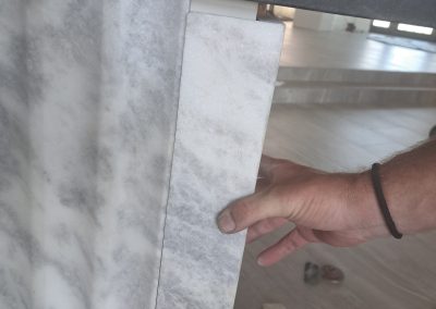 Checking marble waterfall panel fit before installation