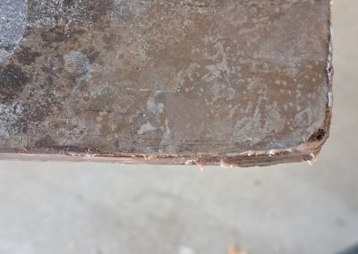Close-up of repaired countertop corner after rust damage restoration