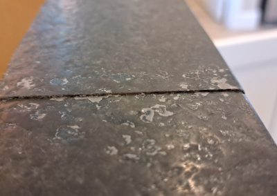 Granite countertop seam gap close-up before repair
