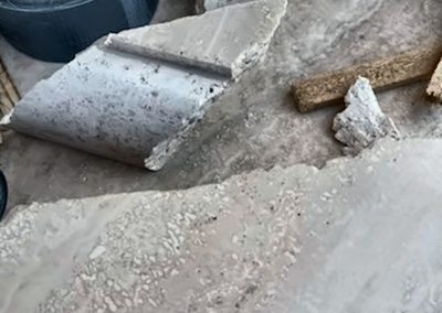 Close-up of broken travertine stone before restoration