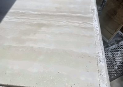 Restored travertine table surface after repair